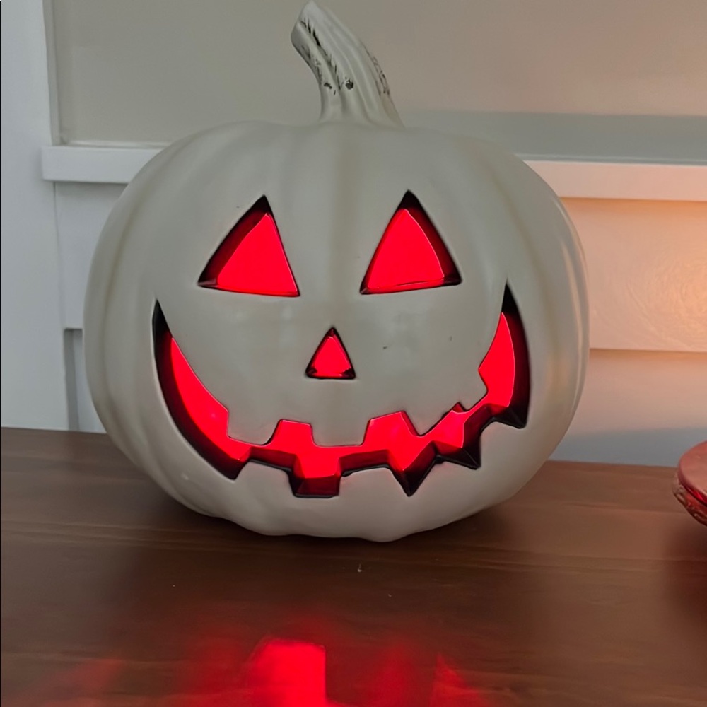Pumpkin, jack-o- lantern with Red LED Light.  plastic 9.5 “ H x 8” W
